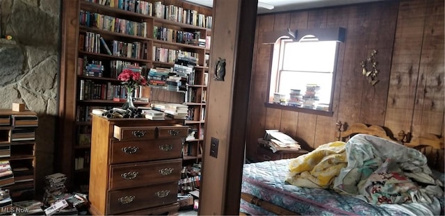 bedroom with wooden walls