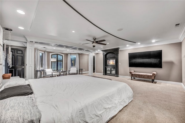 bedroom featuring ceiling fan, ornamental molding, and carpet flooring