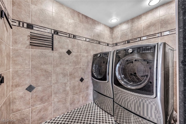 laundry area featuring washing machine and dryer