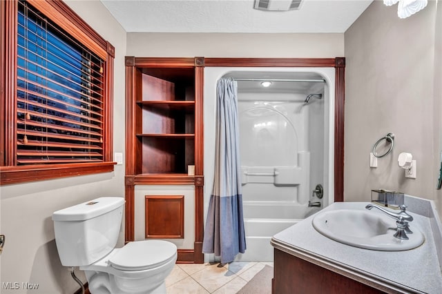 full bathroom with vanity, toilet, shower / bath combo, tile patterned floors, and a textured ceiling