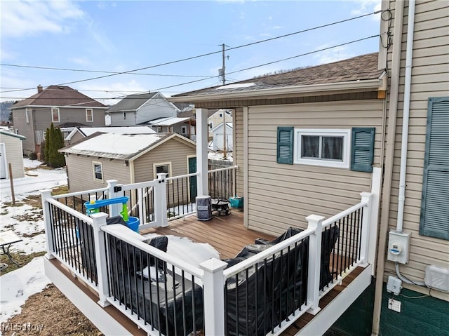 view of snow covered deck