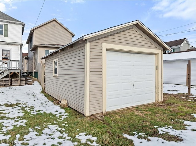 view of snow covered garage