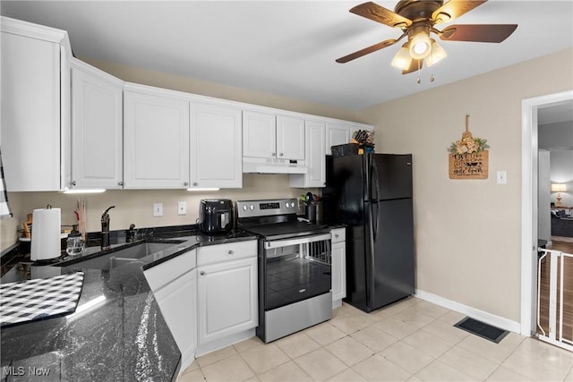 kitchen with stainless steel range with electric stovetop, light tile patterned floors, white cabinetry, and black fridge