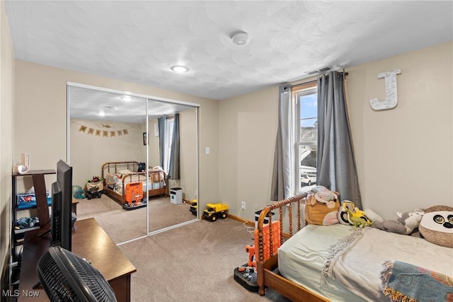 carpeted bedroom featuring a closet