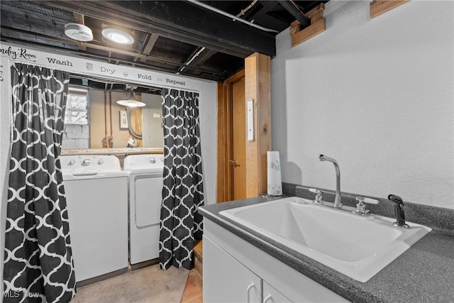 laundry area with sink and washing machine and clothes dryer