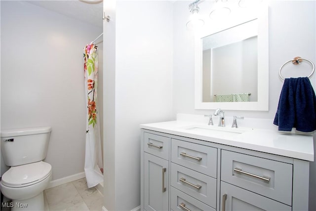 bathroom with vanity, toilet, and a shower with shower curtain