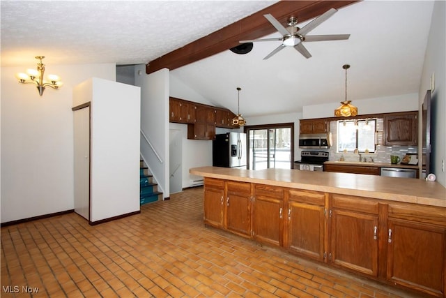 kitchen featuring hanging light fixtures, backsplash, vaulted ceiling with beams, stainless steel appliances, and ceiling fan with notable chandelier