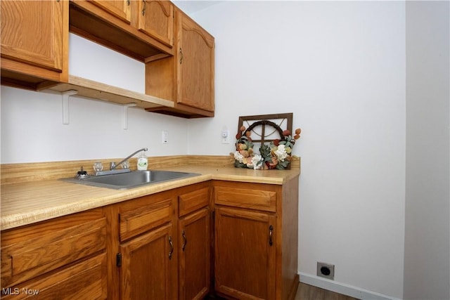 kitchen with sink and hardwood / wood-style floors