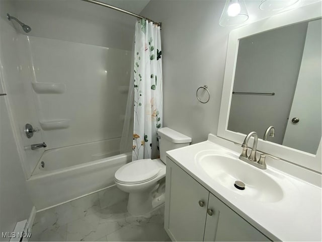 bathroom featuring marble finish floor, vanity, toilet, and shower / bath combo with shower curtain