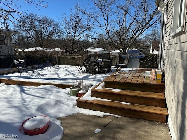 view of snow covered deck