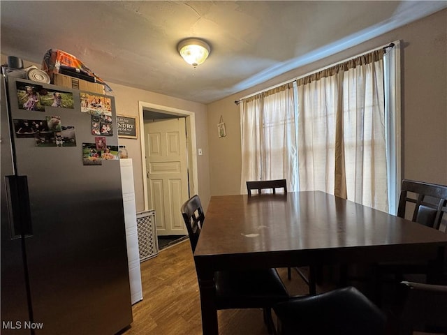 dining area featuring wood-type flooring