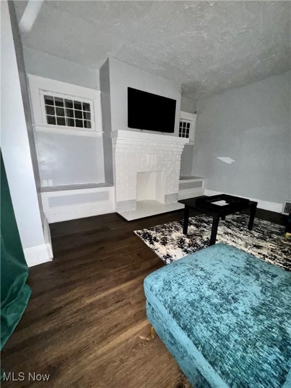 living room with dark hardwood / wood-style floors