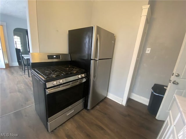 kitchen featuring dark hardwood / wood-style floors and appliances with stainless steel finishes