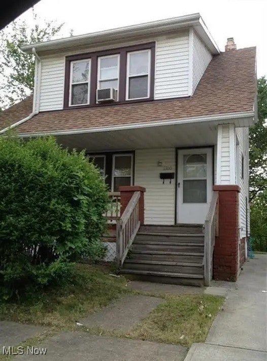 view of front of home featuring cooling unit and a porch