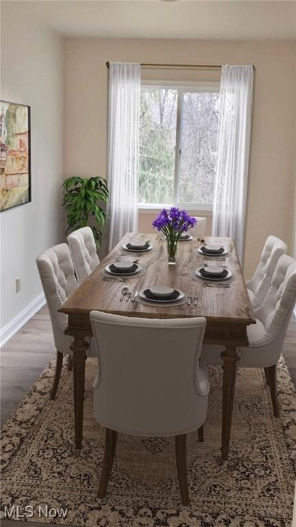 dining area with hardwood / wood-style flooring and a healthy amount of sunlight