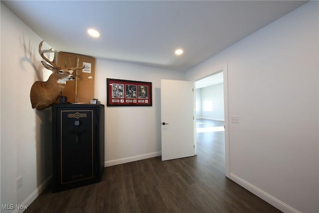 corridor with dark wood-type flooring