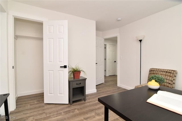 office featuring light wood-type flooring and baseboards