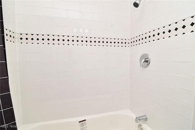 bathroom with shower / washtub combination