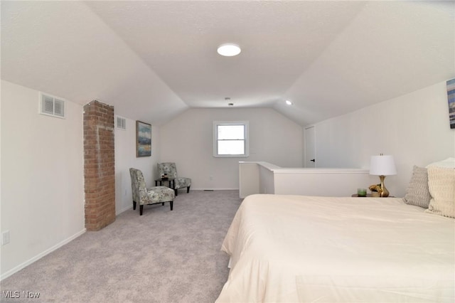 bedroom featuring visible vents, baseboards, lofted ceiling, and carpet floors