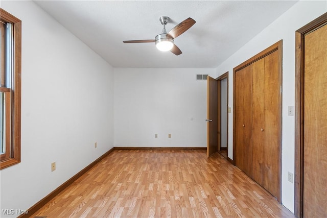 unfurnished bedroom featuring ceiling fan and light hardwood / wood-style floors