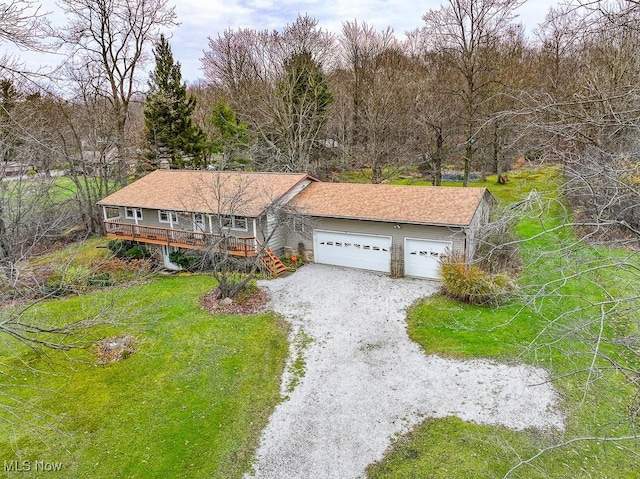 view of front of property with a garage and a front yard