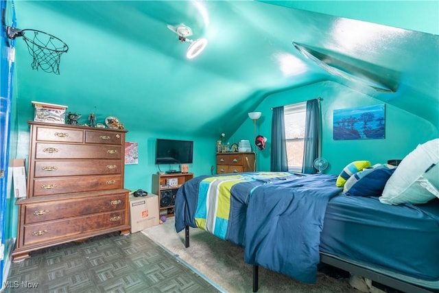 bedroom with lofted ceiling