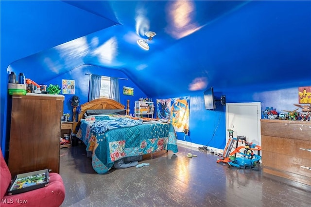 bedroom featuring lofted ceiling