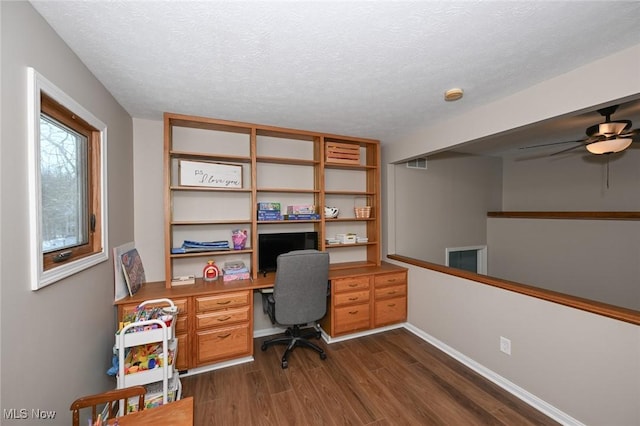 office space featuring dark hardwood / wood-style flooring and a textured ceiling