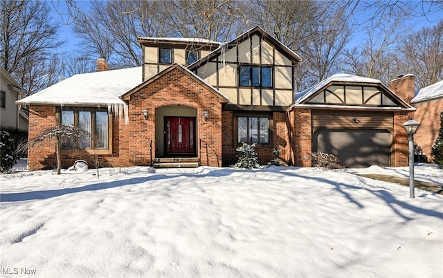 tudor-style house with a garage