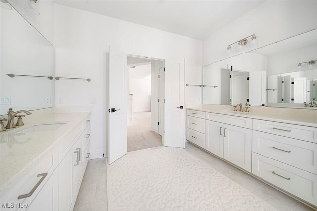 bathroom with tile patterned floors and vanity