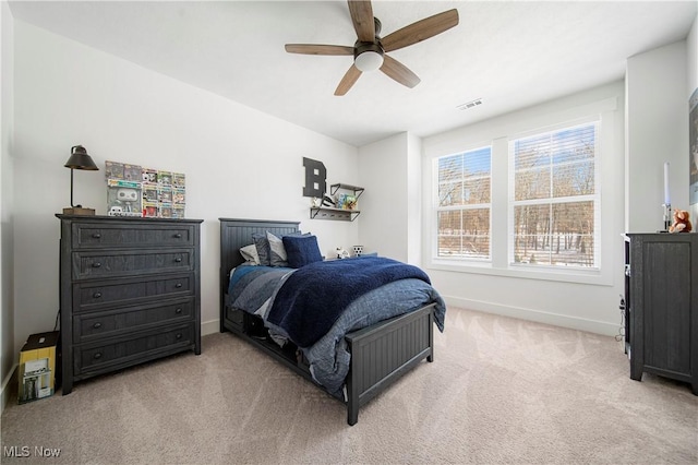 carpeted bedroom featuring ceiling fan