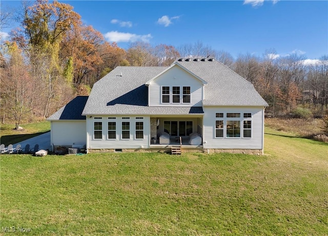 back of house featuring a lawn