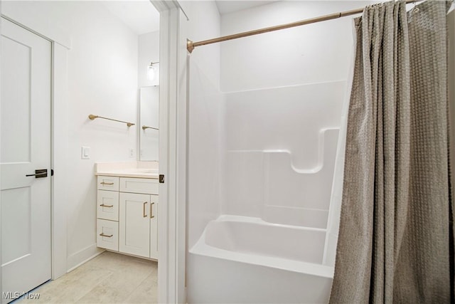 bathroom featuring vanity, shower / tub combo, and tile patterned floors