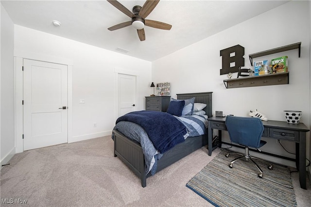 bedroom with light colored carpet and ceiling fan