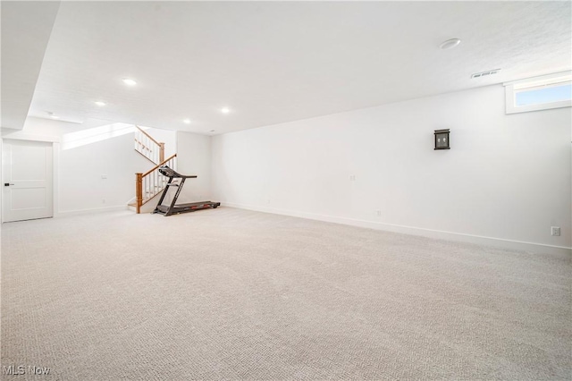 basement with light colored carpet