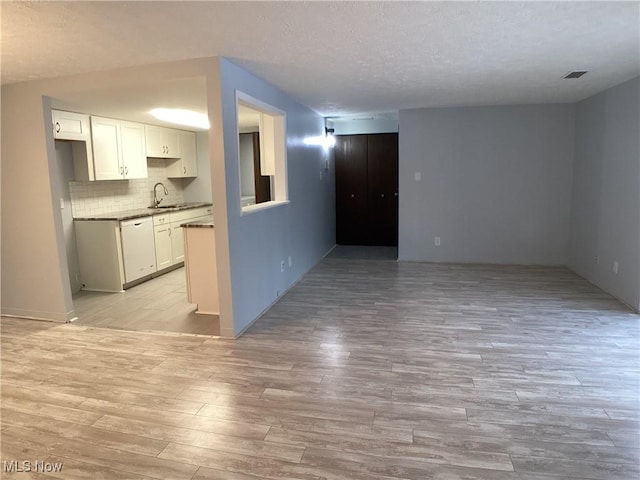 interior space featuring sink and light wood-type flooring