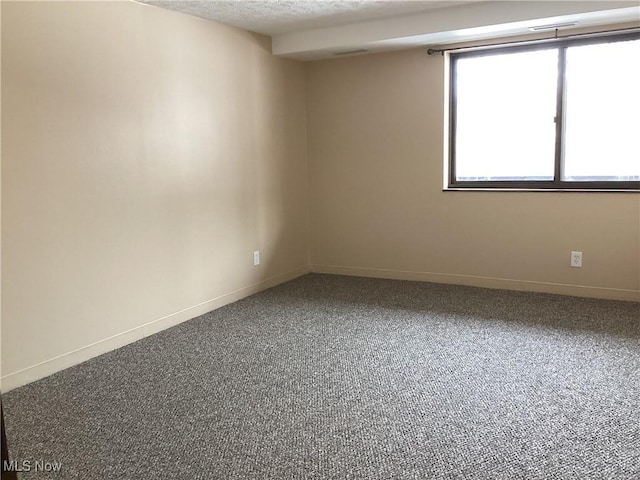 empty room with a textured ceiling