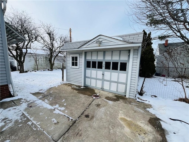 view of snow covered garage