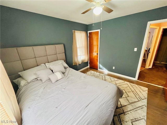 bedroom with hardwood / wood-style floors and ceiling fan