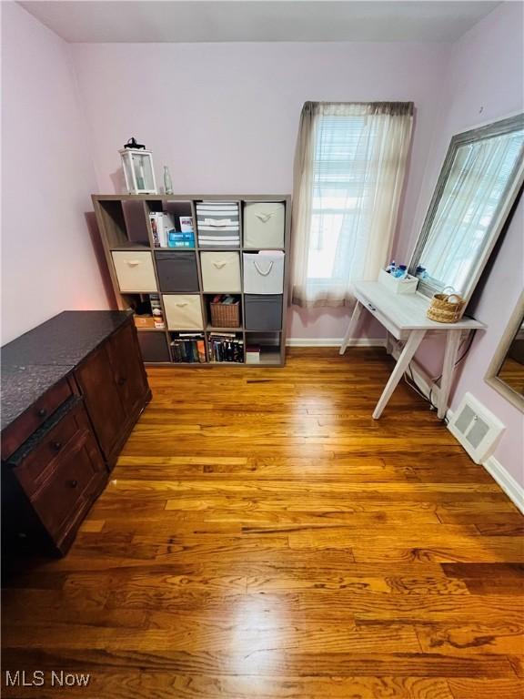 office space featuring hardwood / wood-style floors