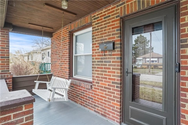 doorway to property with covered porch