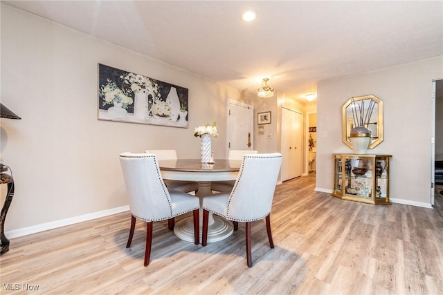 dining room with wood-type flooring