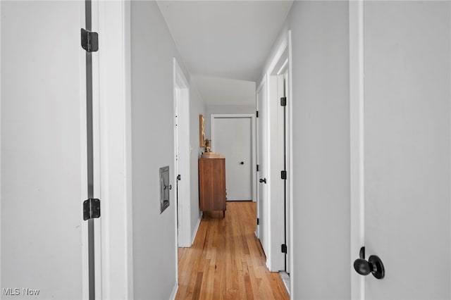 hallway with light hardwood / wood-style flooring