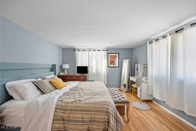 bedroom with wood-type flooring