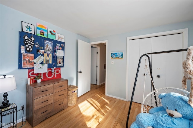 bedroom with a closet and light wood-type flooring