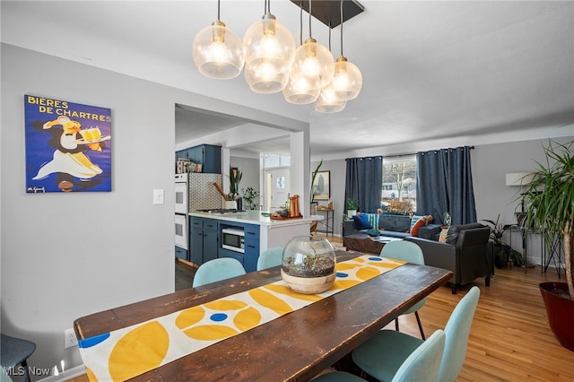 dining area featuring light wood-type flooring