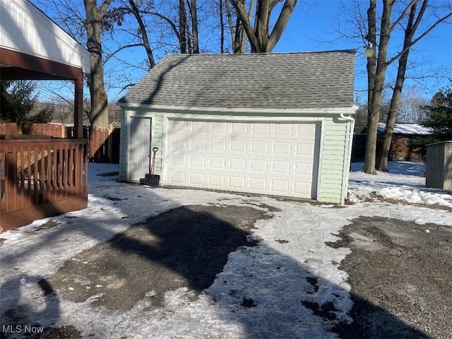 view of snow covered garage