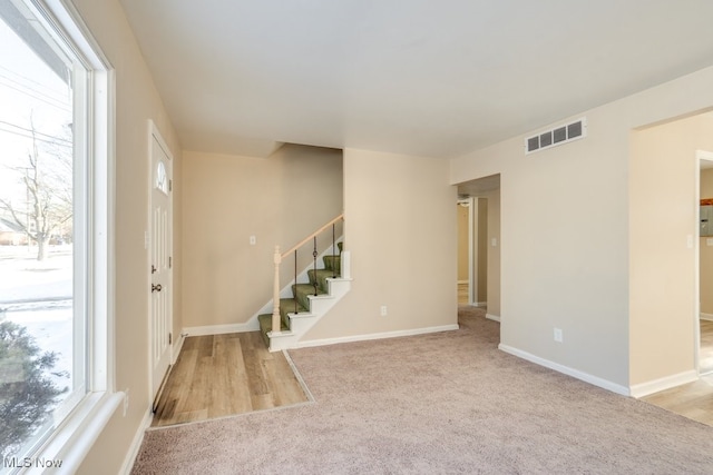 view of carpeted entrance foyer