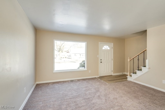 entryway featuring carpet floors