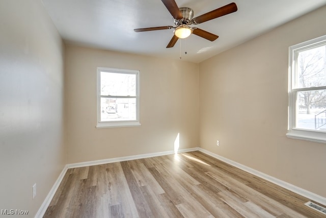 spare room with ceiling fan and light hardwood / wood-style flooring